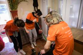Tidying up the surroundings of an animal shelter in Horjul.